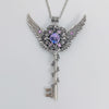 Fantasy floral sterling silver key necklace with wings made with Swarovski crystals.  Fairy jewelry.