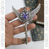 Fantasy floral sterling silver key necklace with wings made with Swarovski crystals.  Fairy jewelry.