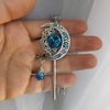 Handmade Magical fantasy moon key necklace with high quality blue crystals.  This unique piece of Fantasy key jewelry makes the perfect sparkly gift!