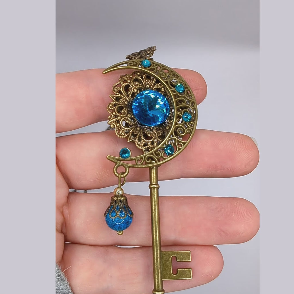 Handmade Magical fantasy moon key necklace with high quality blue crystals.  This unique piece of Fantasy key jewelry makes the perfect sparkly gift!