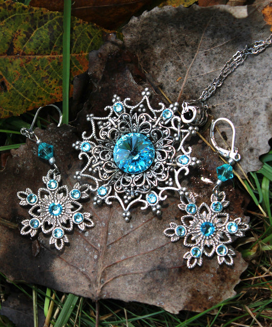 Sterling Silver Snowflake necklace and earring set made with aquamarine Swarovski crystals.
