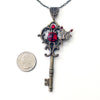 Bronze toned Fairy fantasy key necklace with red Swarovski crystals. 