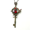 Bronze toned Fairy fantasy key necklace with red Swarovski crystals. 