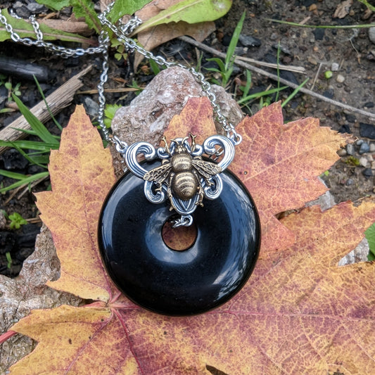 Black onyx donut stone necklace with bumble bee.  Bumblebee jewelry gift.